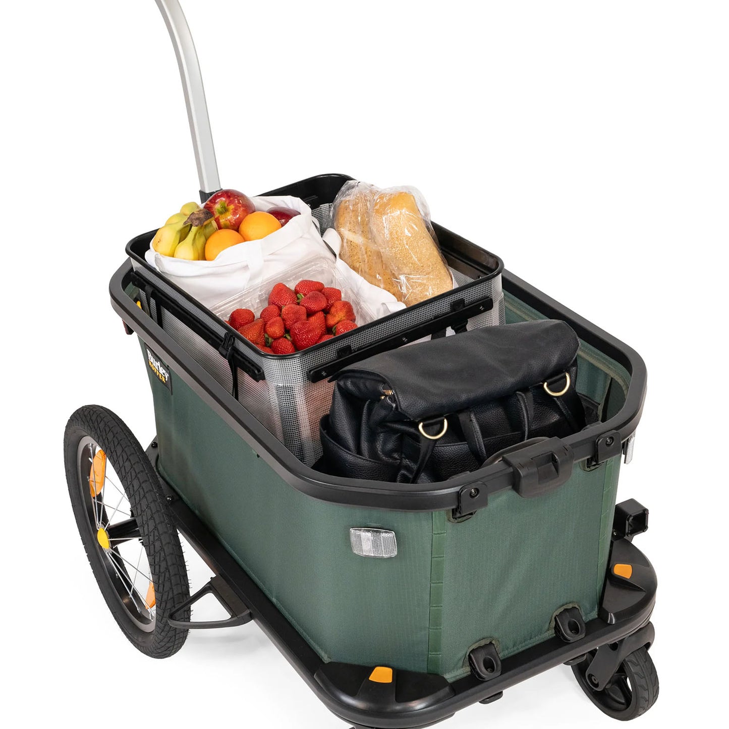 Rear quarter view of the Burley Hopper Cargo Trailer, shown loaded with groceries, with a white background