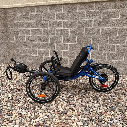 Non-drive side view of the Catrike Demo All Road eCat with Bosch BES3 Electric Blue Recumbent Trike in an outdoor setting.