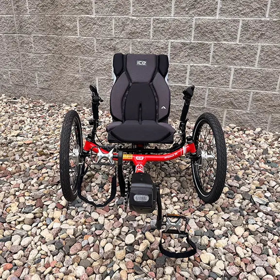 Front view of the ICE Demo Sprint Pixel RS STEPS EP6 Passion Red Recumbent Trike in an outdoor setting.