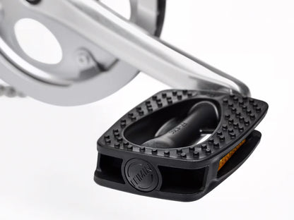 Detail view view of a pedal on the Electra Townie 7D Step-Thru 26 Inch Wheeled Bike in Kiwi, shown on a white background.