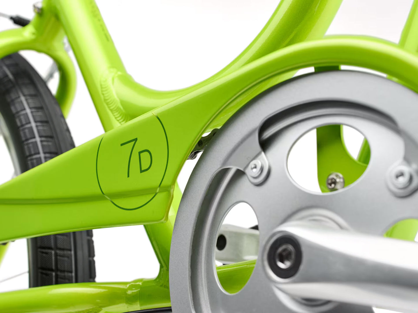 Detail view view of the crankset of the Electra Townie 7D Step-Thru 26 Inch Wheeled Bike in Kiwi, shown on a white background.