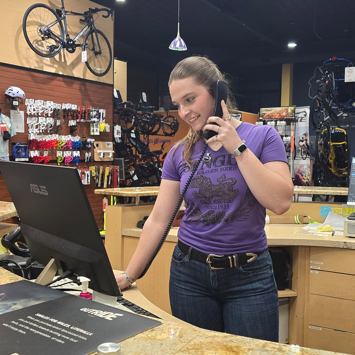 A Hostel Shoppe employee answers the phone.