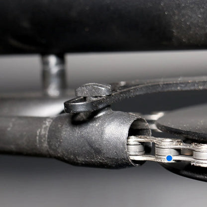 View of the black Hase Chain Tube Plastic Bracket Full Tube installed on a supporting bracket on a Hase Trike. background.