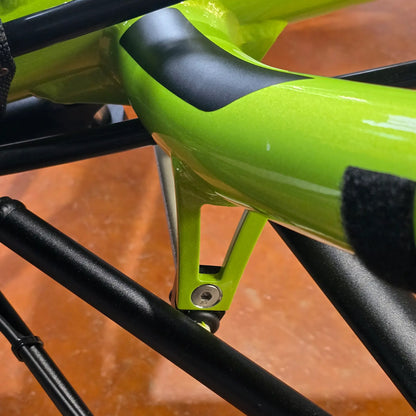 View of the HP Velotechnik Bolt for Front Suspension Stabilizer Bracket on a green front suspended trike.