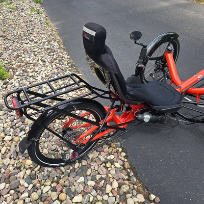 Closeup view of the rear rack and back of the HP Velotechnik Used Scorpion fs 20 Orange Recumbent Trike in an outdoor setting.