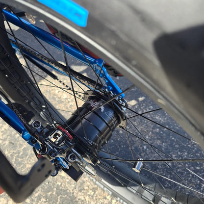Closeup view of the Rohloff hub on the ICE Full Fat RS Rohloff Shimano EP8 Hostel Shoppe Limited Edition Custom Blue Recumbent Trike outside in front of the Hostel Shoppe.