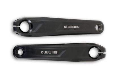 A top view of a pair of black ICE Take-Off Shimano Steps EP6 170mm Crankarms with Slots with the Shimano logo in white. 