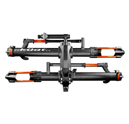 A side view of a Kuat NV 2.0 gray and orange anodized bike rack for two bikes that will fit a 2 inch receiver hitch. 