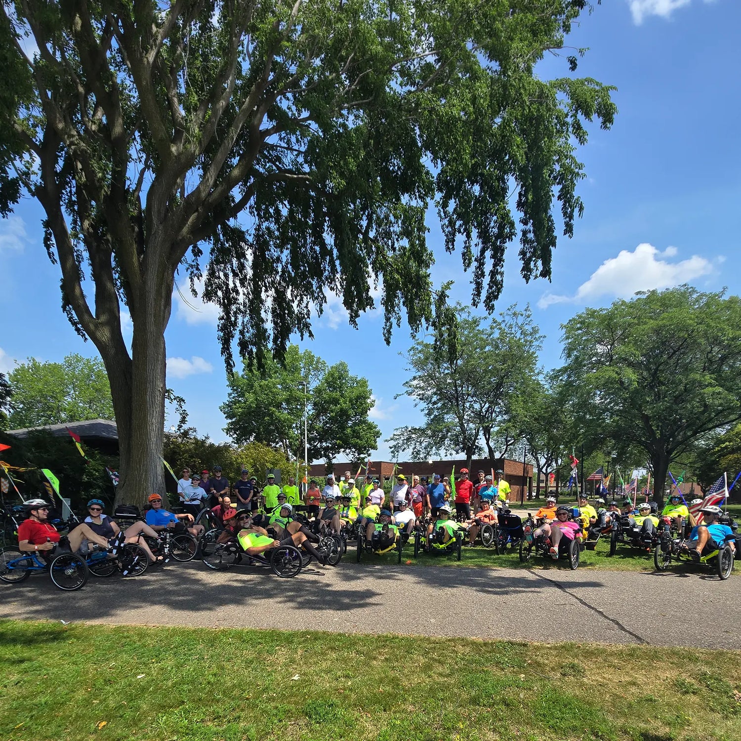 Group photo of the cyclists on the 17 mile ride in front of the Riverfront Arts Center at the Pedal Point Rally in Stevens Point, Wisconsin.
