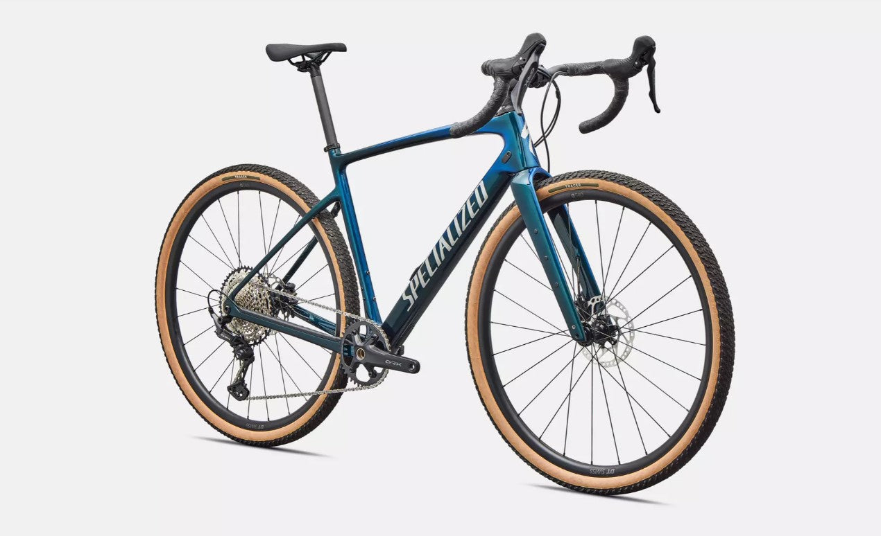 Front right profile view of blue Specialized Diverge Sport road bicycle with brown sidewall tires on a white background.