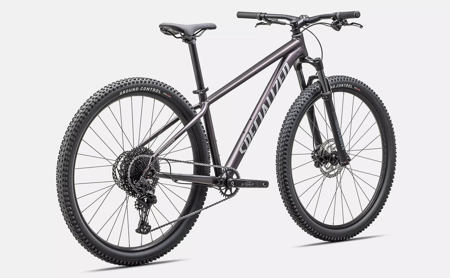 Rear quarter view of the Specialized Rockhopper Comp 29 Mountain Bike in Nebula Metallic / Dolomite Metallic, shown on a white background.