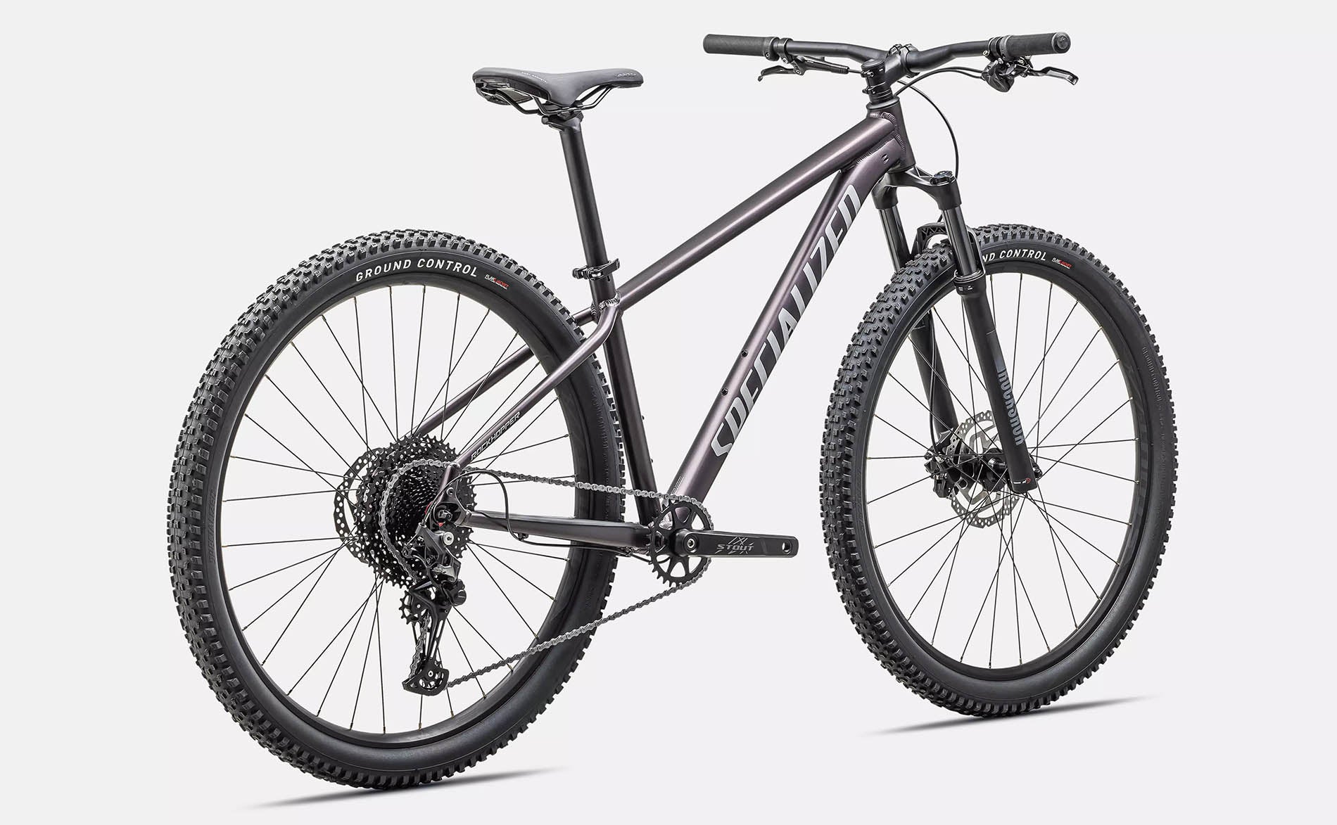 Rear quarter view of the Specialized Rockhopper Comp 29 Mountain Bike in Nebula Metallic / Dolomite Metallic, shown on a white background.