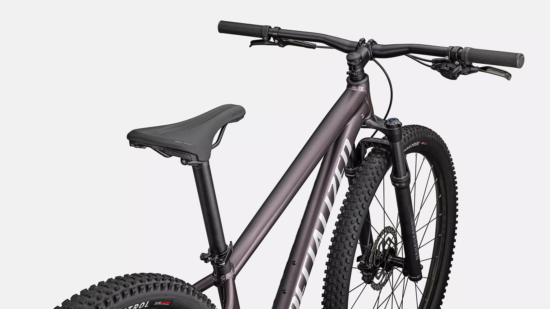 Cockpit view of the Specialized Rockhopper Comp 29 Mountain Bike in Nebula Metallic / Dolomite Metallic, shown on a white background.