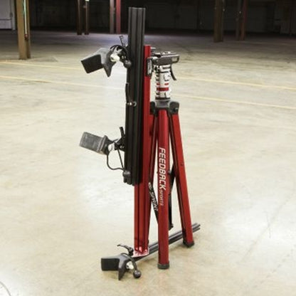 Close-up of a folded red repair stand in an indoor setting.