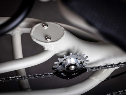 A close up view of an idler cog and chain of the TerraTrike GTS Recumbent Trike in Fog.