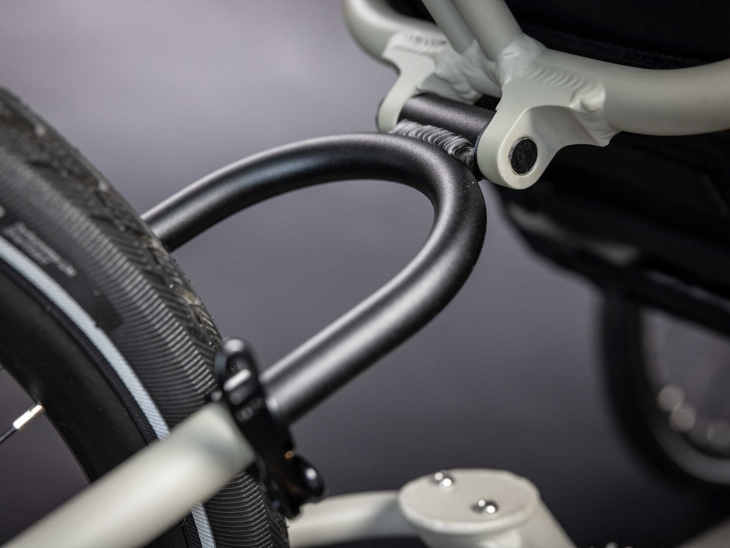The rear seat stays in black of TerraTrike GTS Recumbent Trike in Fog.