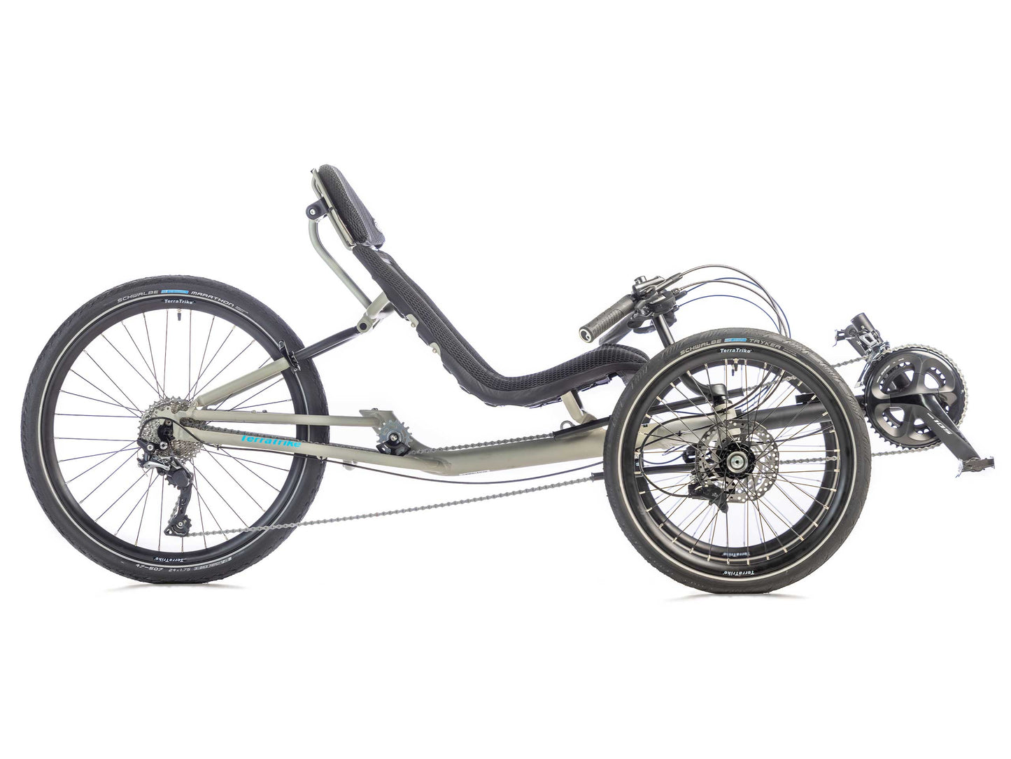 Side view of a TerraTrike GTS Recumbent tadpole trike in fog (a grey color) with a mesh seat, 24 inch rear wheel and 20 inch front wheels.