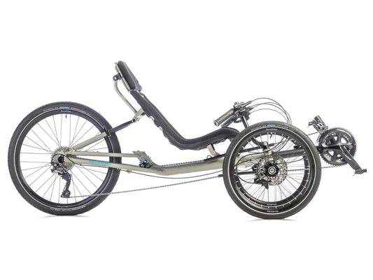 Side view of a TerraTrike GTS Recumbent tadpole trike in fog (a grey color) with a mesh seat, 24 inch rear wheel and 20 inch front wheels.