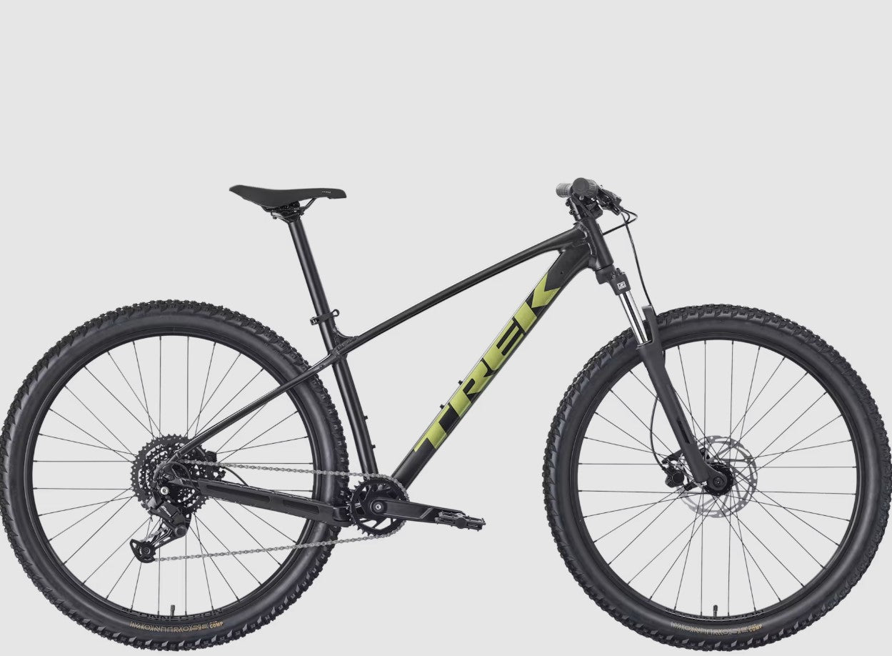 Black and green Trek Marlin 4 mountain bike on a light gray background