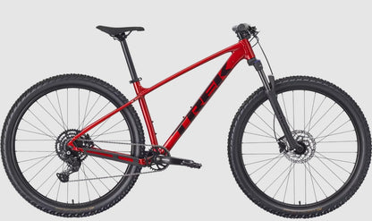 Red Trek Marlin 5 mountain bike with black accents on a light gray background.