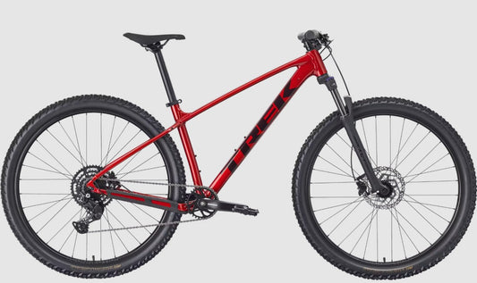 Red Trek Marlin 5 mountain bike with black accents on a light gray background.