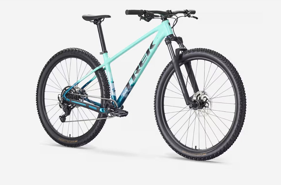 A seafoam green Trek Marlin 5 bicycle with black components on a white background.