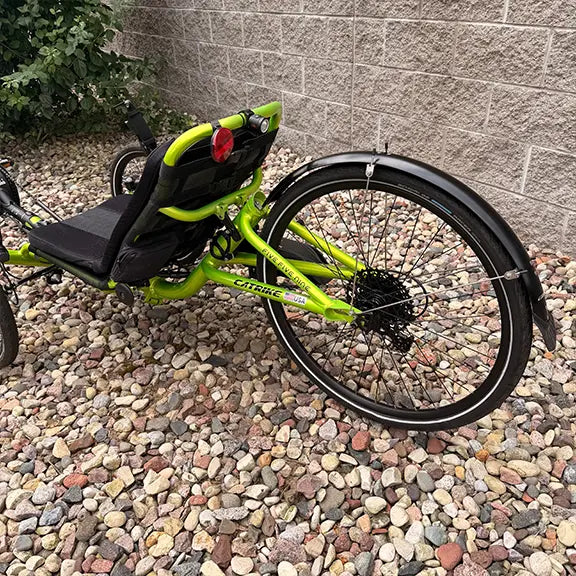 Rear closeup view of the Catrike Used 5.5.9 eCat Eon Green Recumbent Trike in an outdoor setting.