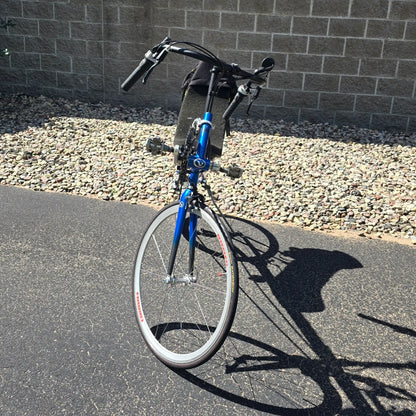 Front view of the Volae Used Club Dual 650c Blue Small Recumbent Bike in an outdoor setting.