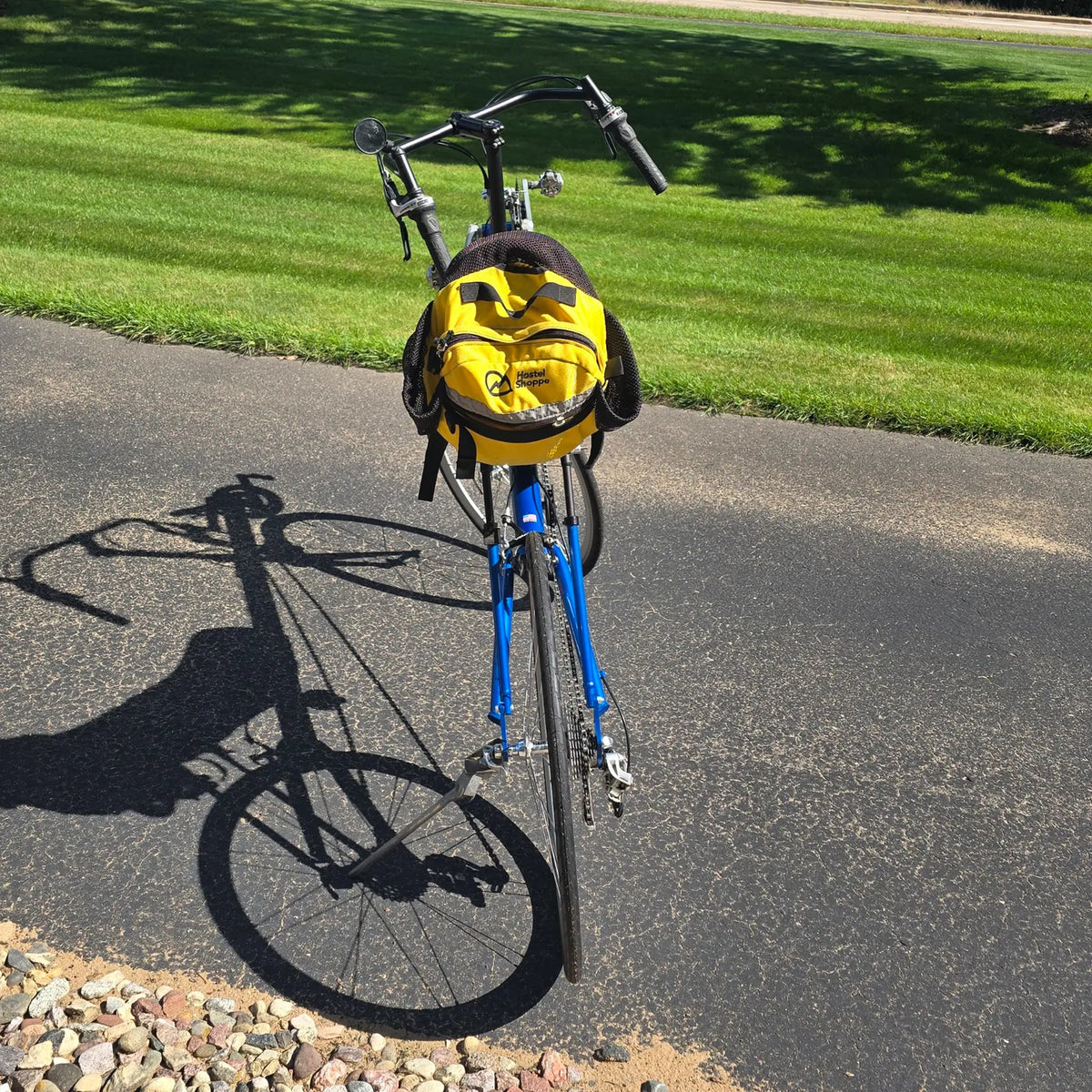Rear view of the Volae Used Club Dual 650c Blue Small Recumbent Bike in an outdoor setting.