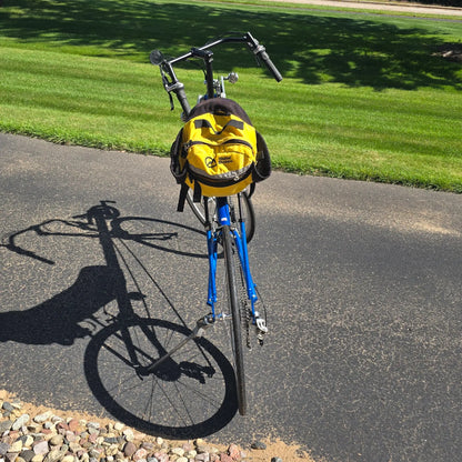 Rear view of the Volae Used Club Dual 650c Blue Small Recumbent Bike in an outdoor setting.
