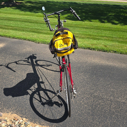 Rear view of the Volae Used Club Dual 650c Red Large Recumbent Bike in an outdoor setting.