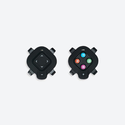 Closeup view of the Zwift Click module for a Wahoo indoor cycling trainer against a white background.
