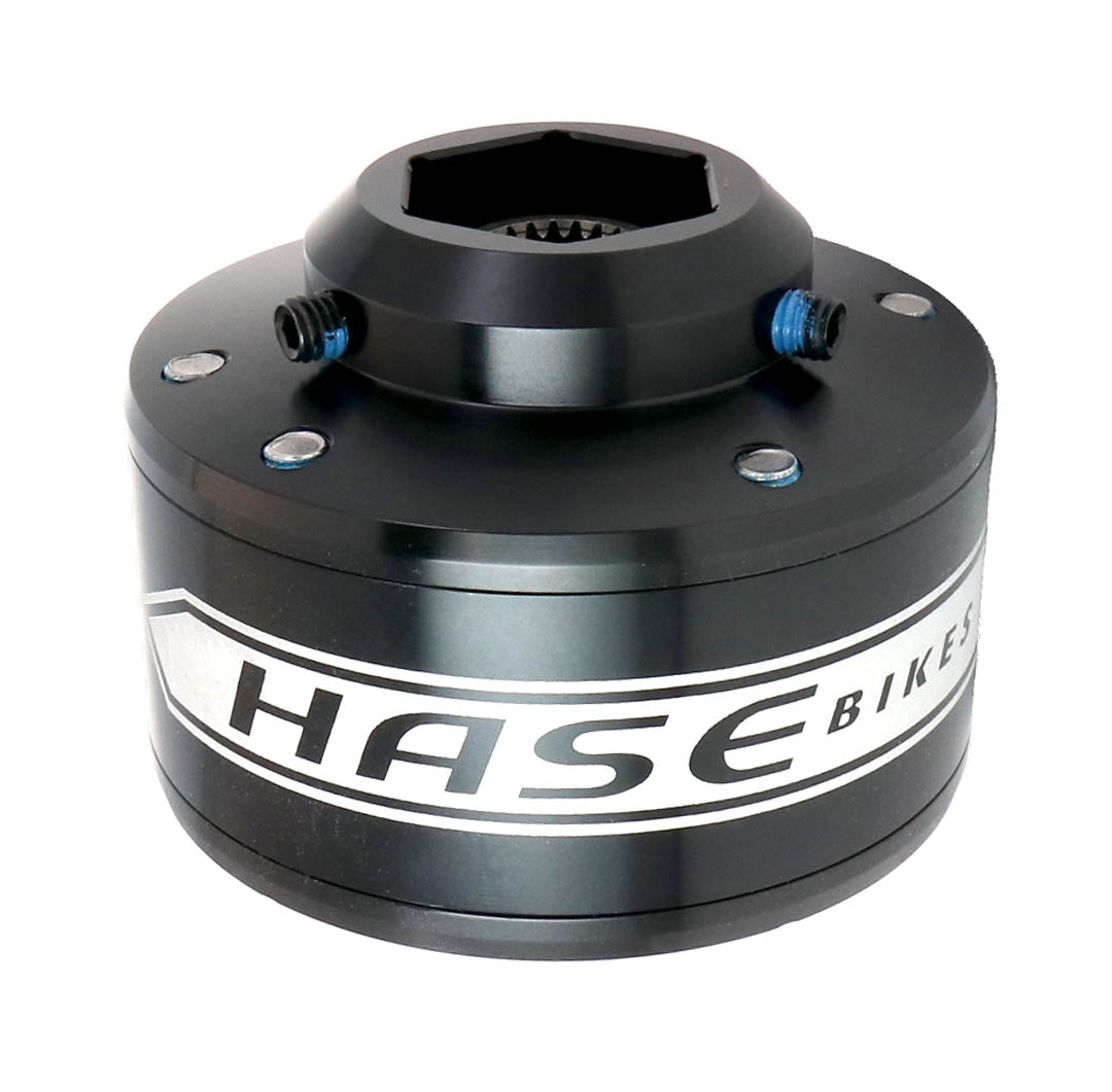 Studio view of a black Hase Trigo Differential with a white stripe around it that says Hase Bikes in black lettering. 