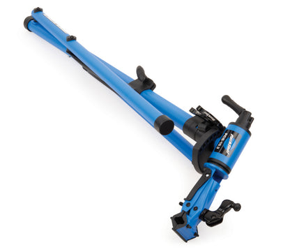 Studio image of the blue and black repair stand in its fully collapsed position. 
