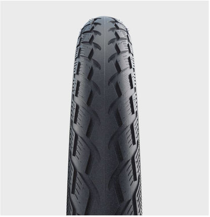 Studio image of the close up of the tread on a tire