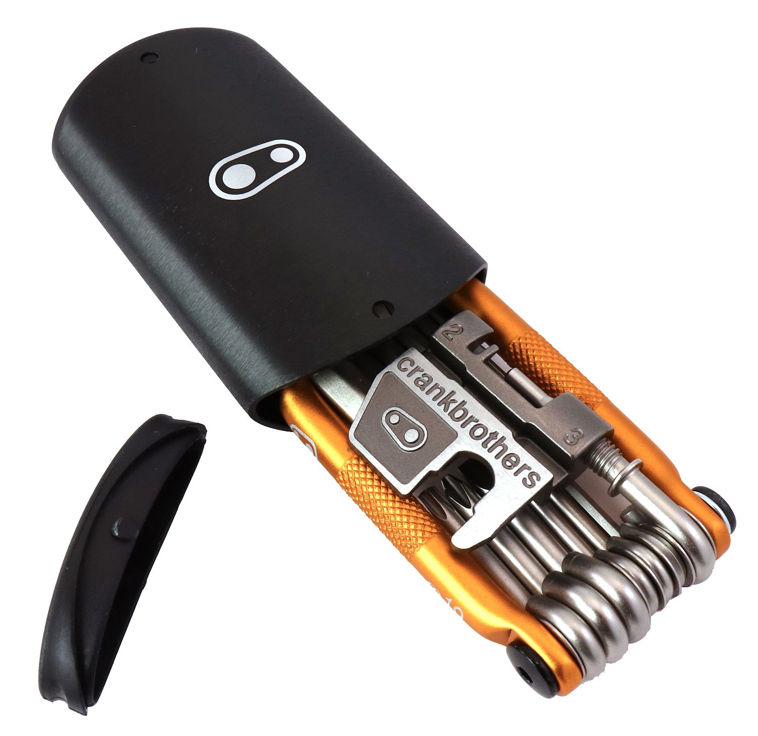 Studio image of a gold and silver Crank Brothers multi-tool inserting into its black case. 